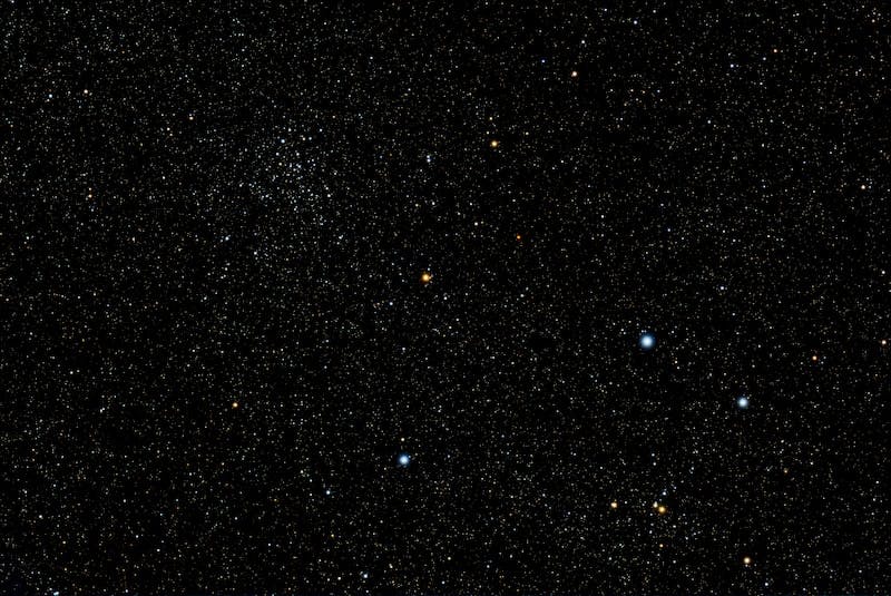 a cluster of stars in the night sky